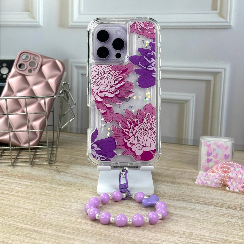 Antigolpes y strap flores rosa y moradas IPH 16 PRO