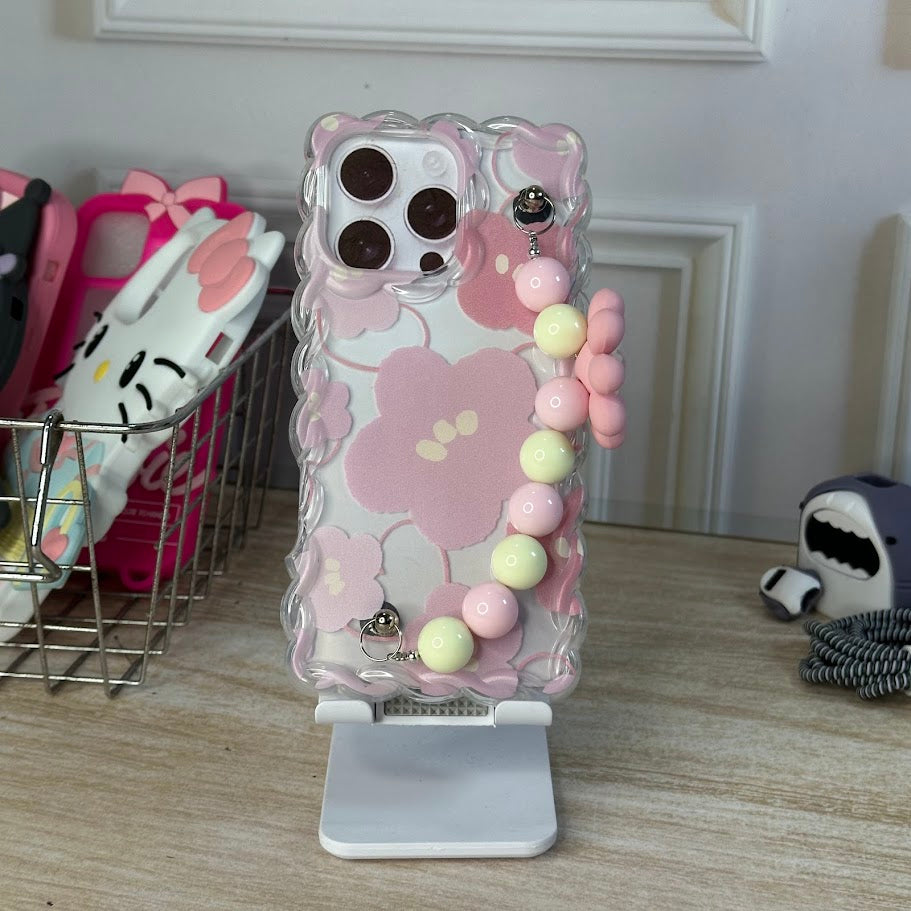 Flores y colgante rosado IPH 16 PRO MAX